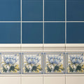 Baroque blue field tile featuring blue and white ceramic with delicate lavender yellow and green floral designs