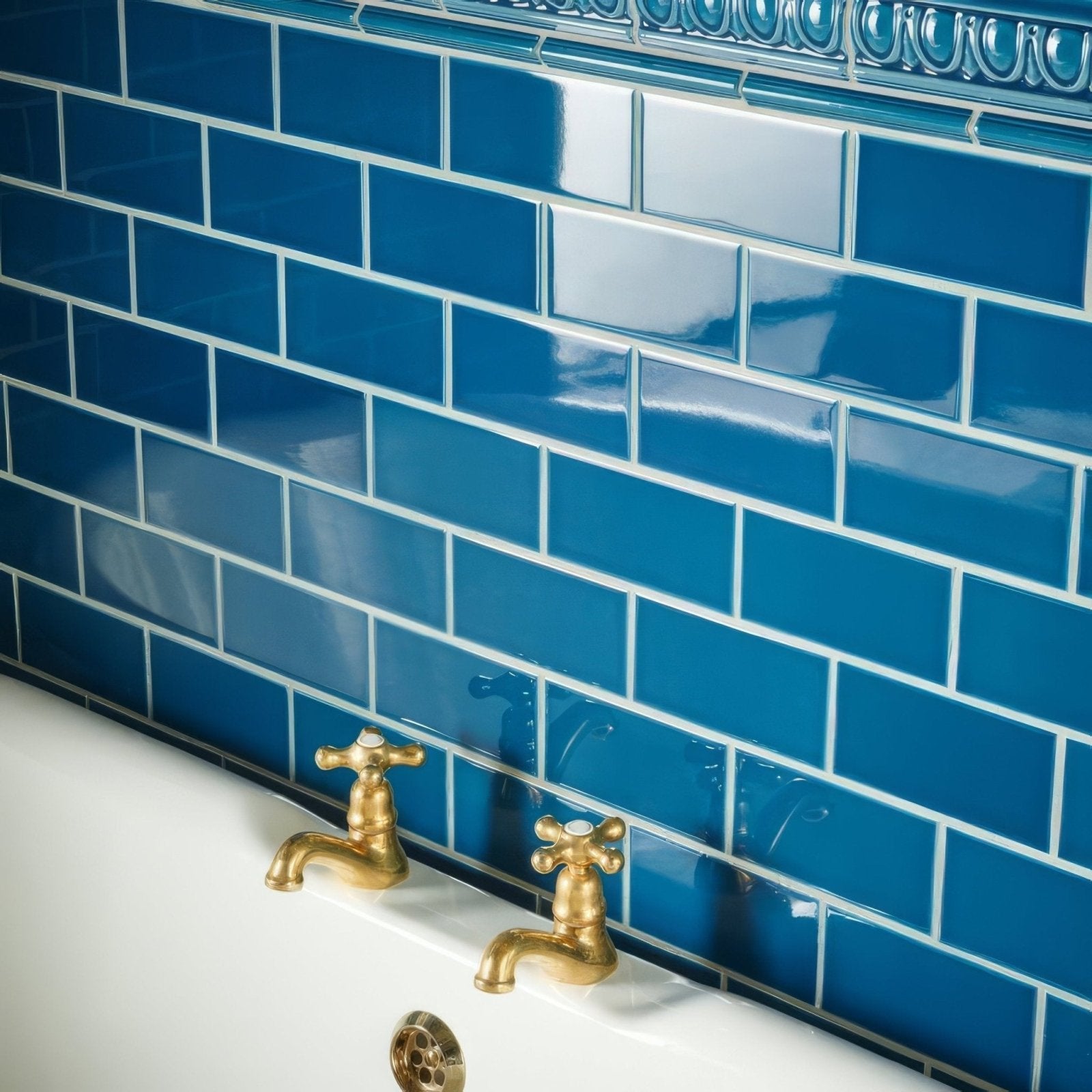 Vibrant cobalt blue glossy baroque blue half tile subway tiles with a decorative ornate border for wall decor