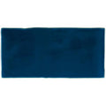 Bastille brick tile is a rectangular navy blue ceramic tile with a smooth glossy finish and slightly uneven edges