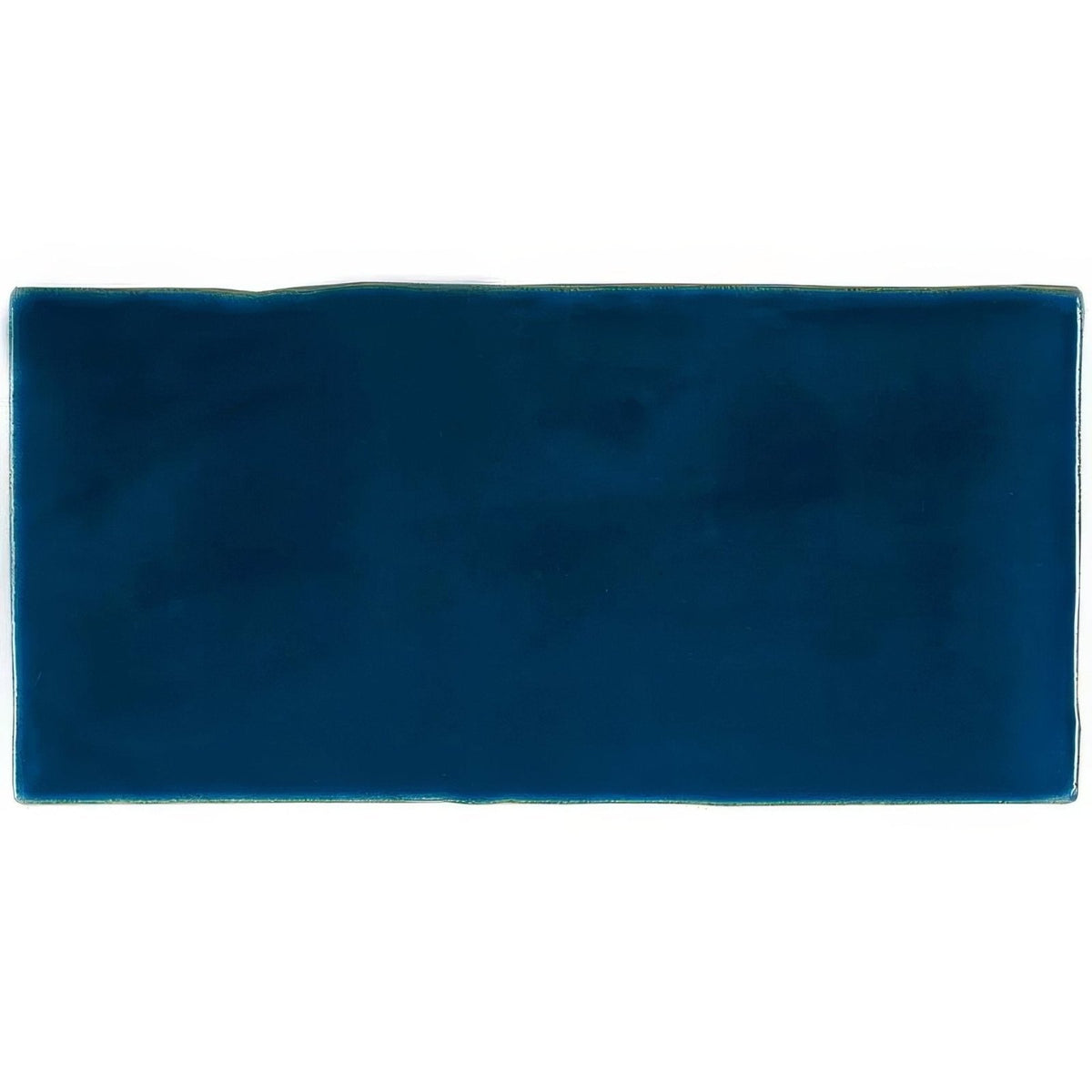 Bastille brick tile is a rectangular navy blue ceramic tile with a smooth glossy finish and slightly uneven edges