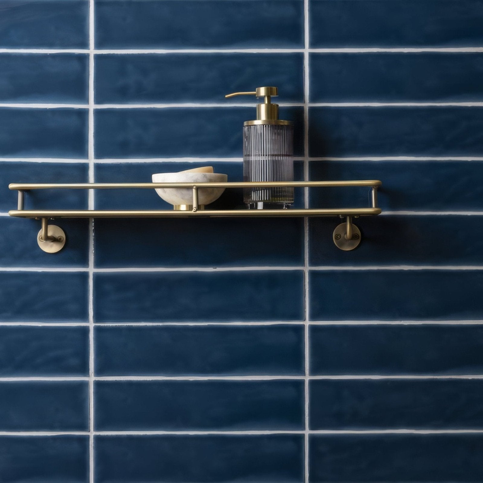 Brass double-tiered bathroom shelf with sleek minimalist design featured on bastille large brick tile background