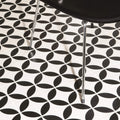 Black and white geometric patterned floor tiles featuring overlapping oval shapes in bavaria black on dover white