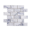 Carrara white tumbled marble brick mosaic sheet laid in a staggered running bond