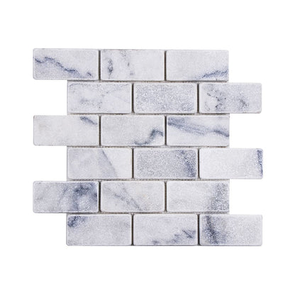 Carrara white tumbled marble brick mosaic sheet laid in a staggered running bond
