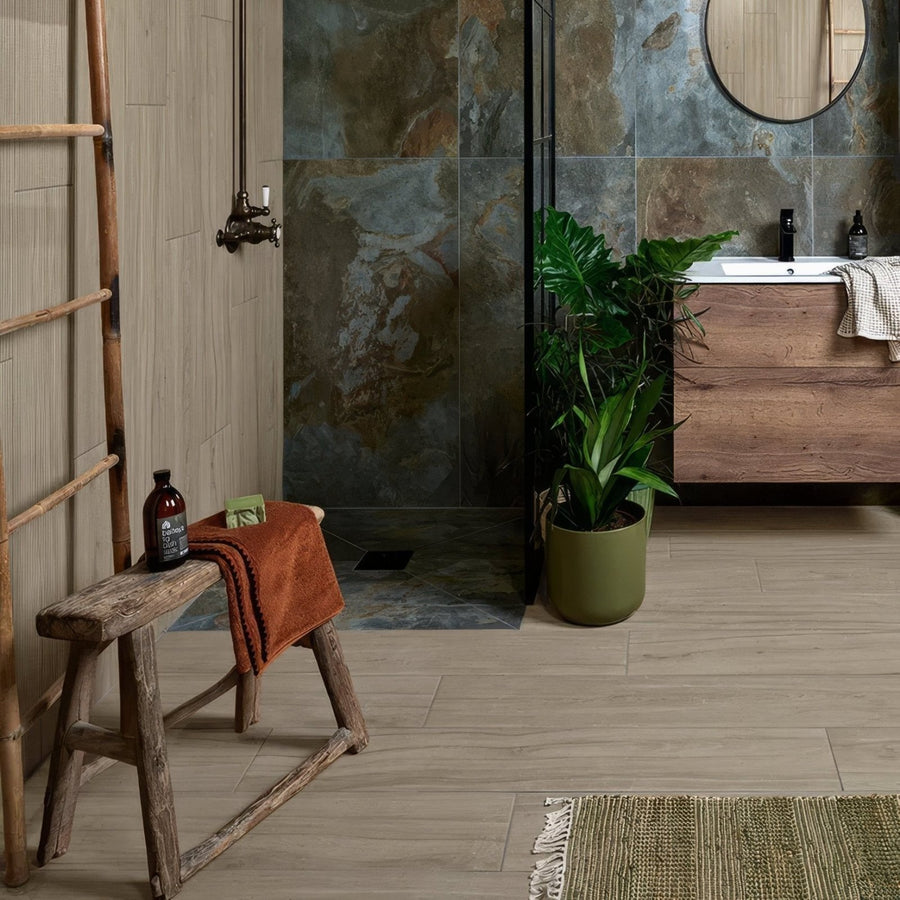 Rustic wooden stool with weathered finish and natural wood grain featuring simple slatted design in caramel tone