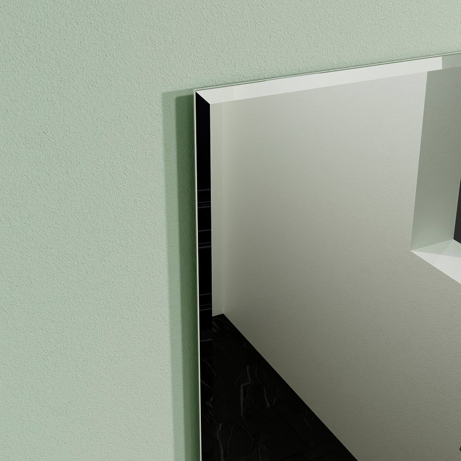 Belvoir rectangular mirror 58 with a sleek modern slim black frame mounted on a light green wall
