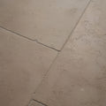 Beige bergamo limestone tiles with lightly seasoned finish featuring natural texture and subtle veining