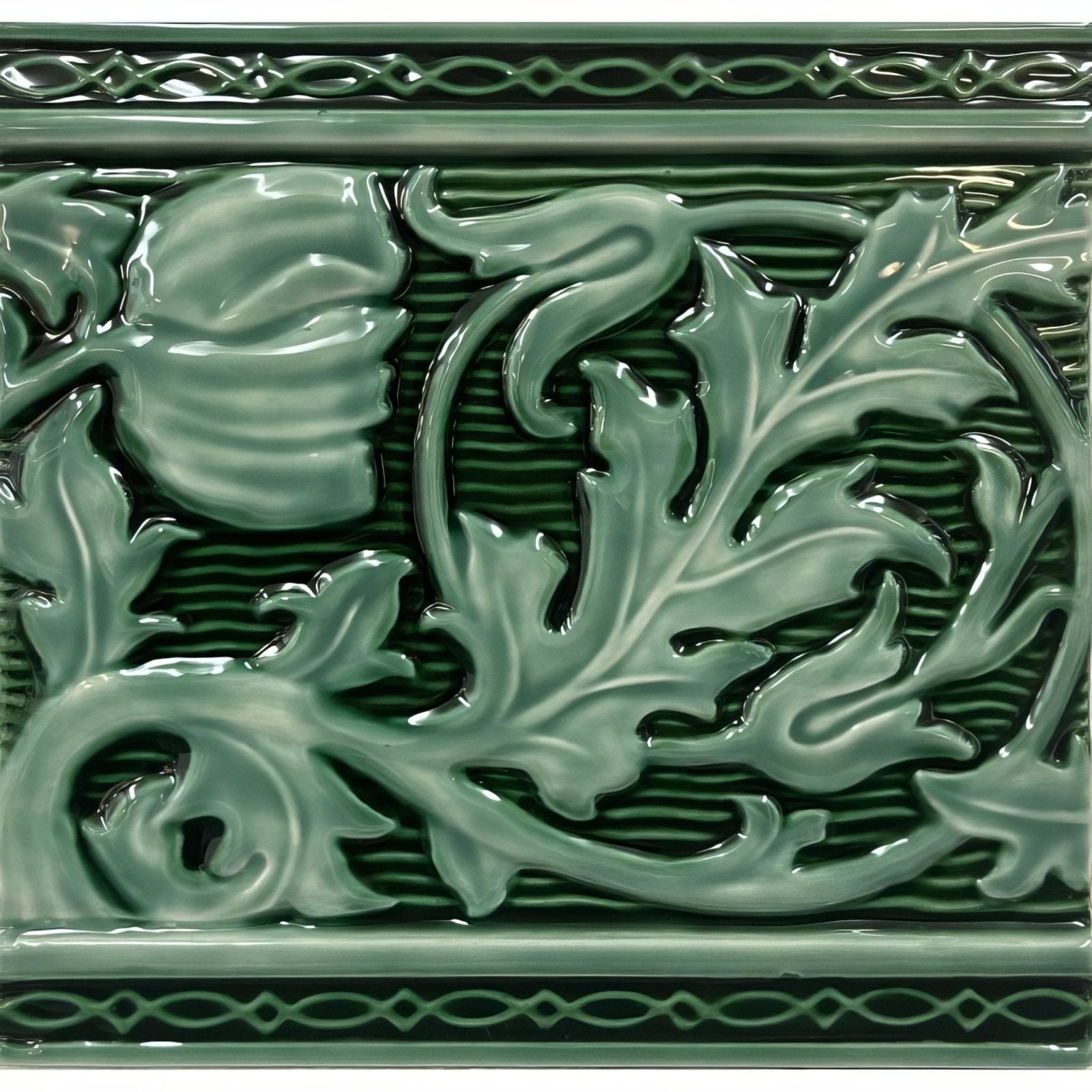 A glossy sage green ceramic tile named Berkeley Jade Breeze on Victorian Green with raised floral and leaf patterns