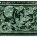 A glossy sage green ceramic tile named Berkeley Jade Breeze on Victorian Green with raised floral and leaf patterns