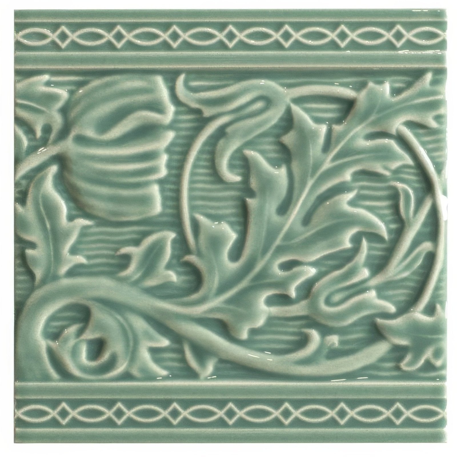A square mint green ceramic tile with raised floral and leaf patterns and decorative border motifs from Berkeley on jade breeze