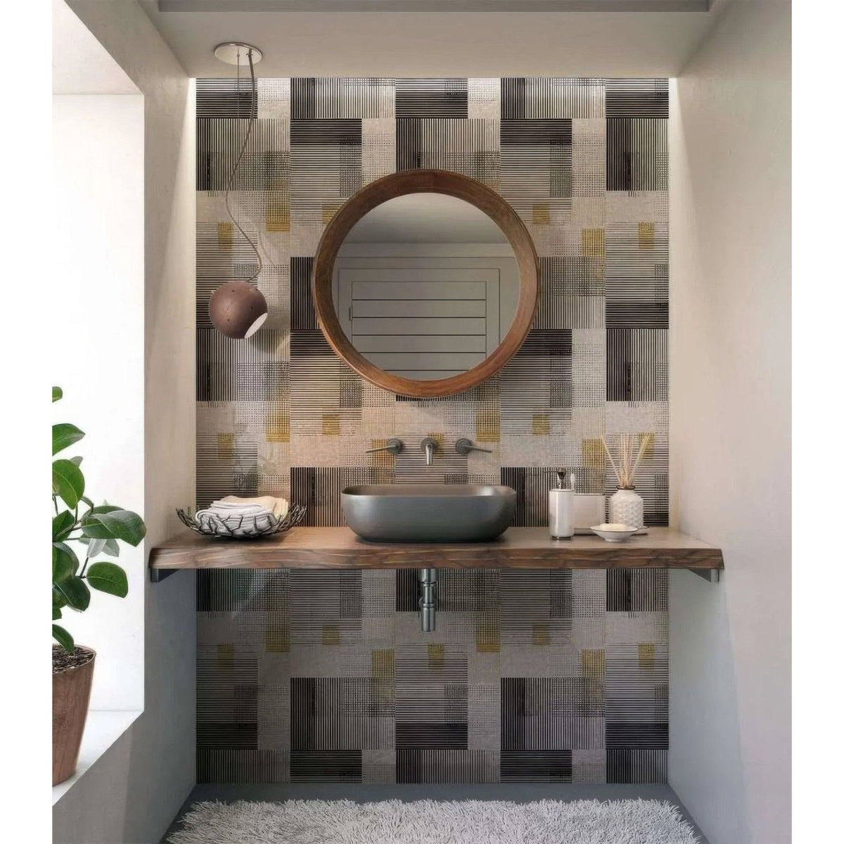 Round wooden-framed mirror above a dark gray ceramic vessel sink in a bathroom with berlin geometric shower wall panel