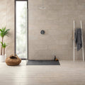 Modern minimalist berliner sand natural shower with sleek matte gray tiles and contemporary chrome rainhead