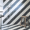 Bert & May black alalpardo porcelain bathroom tiles with black and white diagonal striped modern geometric pattern