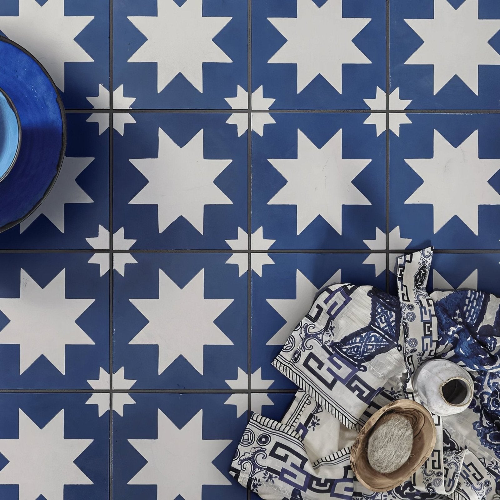 Blue and white star-patterned porcelain floor tiles by bert and may for decorative flooring use