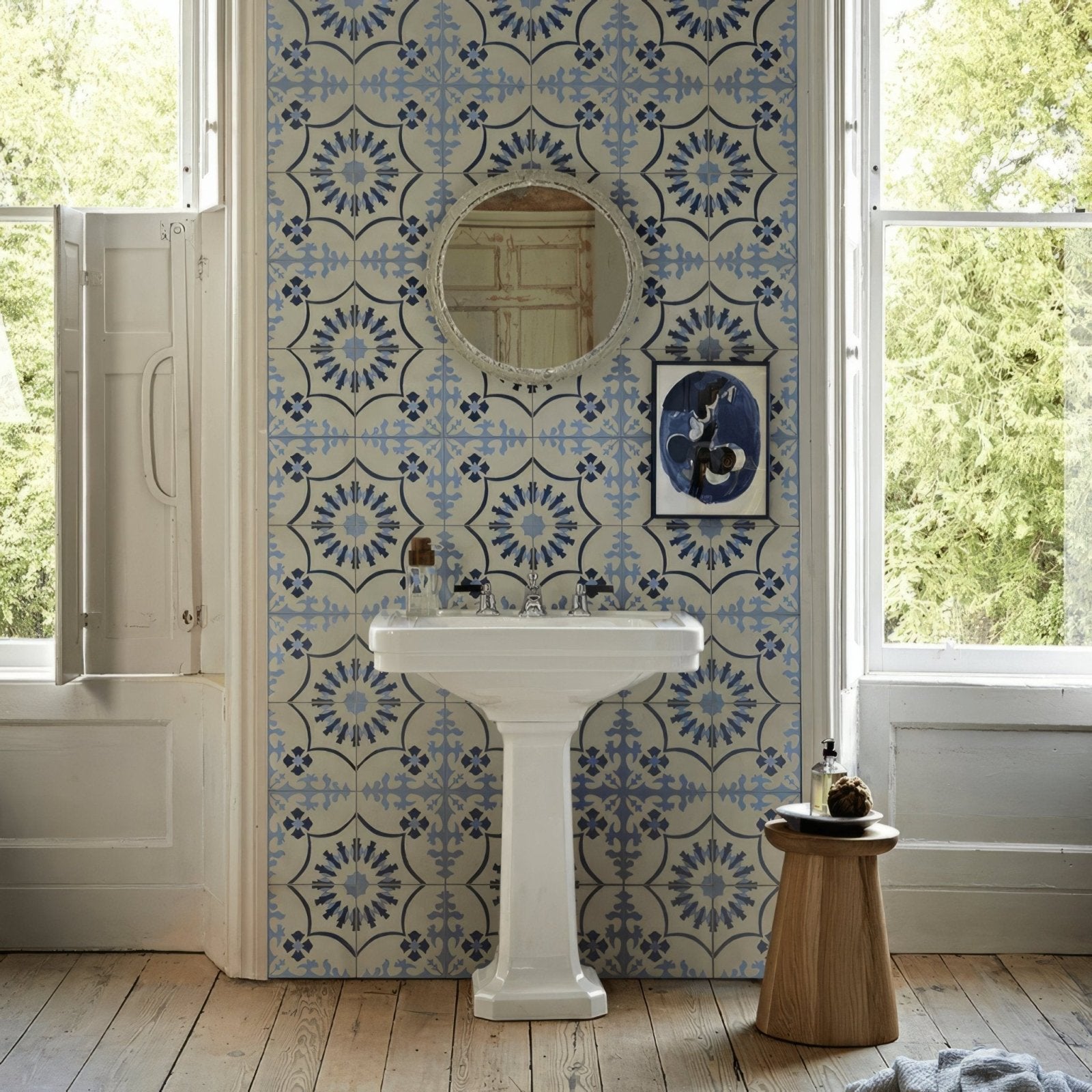 White pedestal sink with classic design and chrome fixtures from bert and may bolonia navy porcelain collection