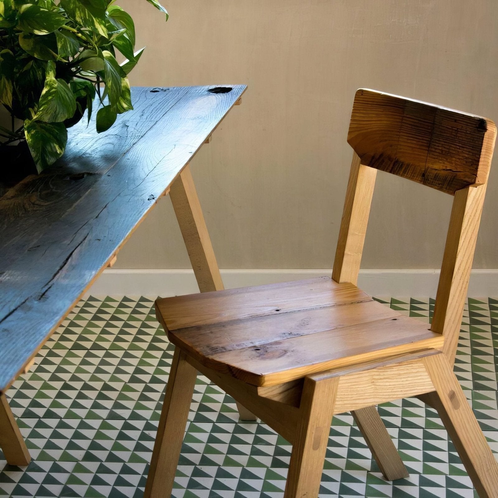 A rustic wooden chair with natural finish and slatted seat and backrest from Bert & May Green Majadas Porcelain