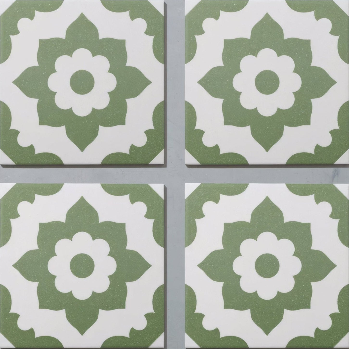 Four green and white floral patterned porcelain tiles from bert and may santona collection