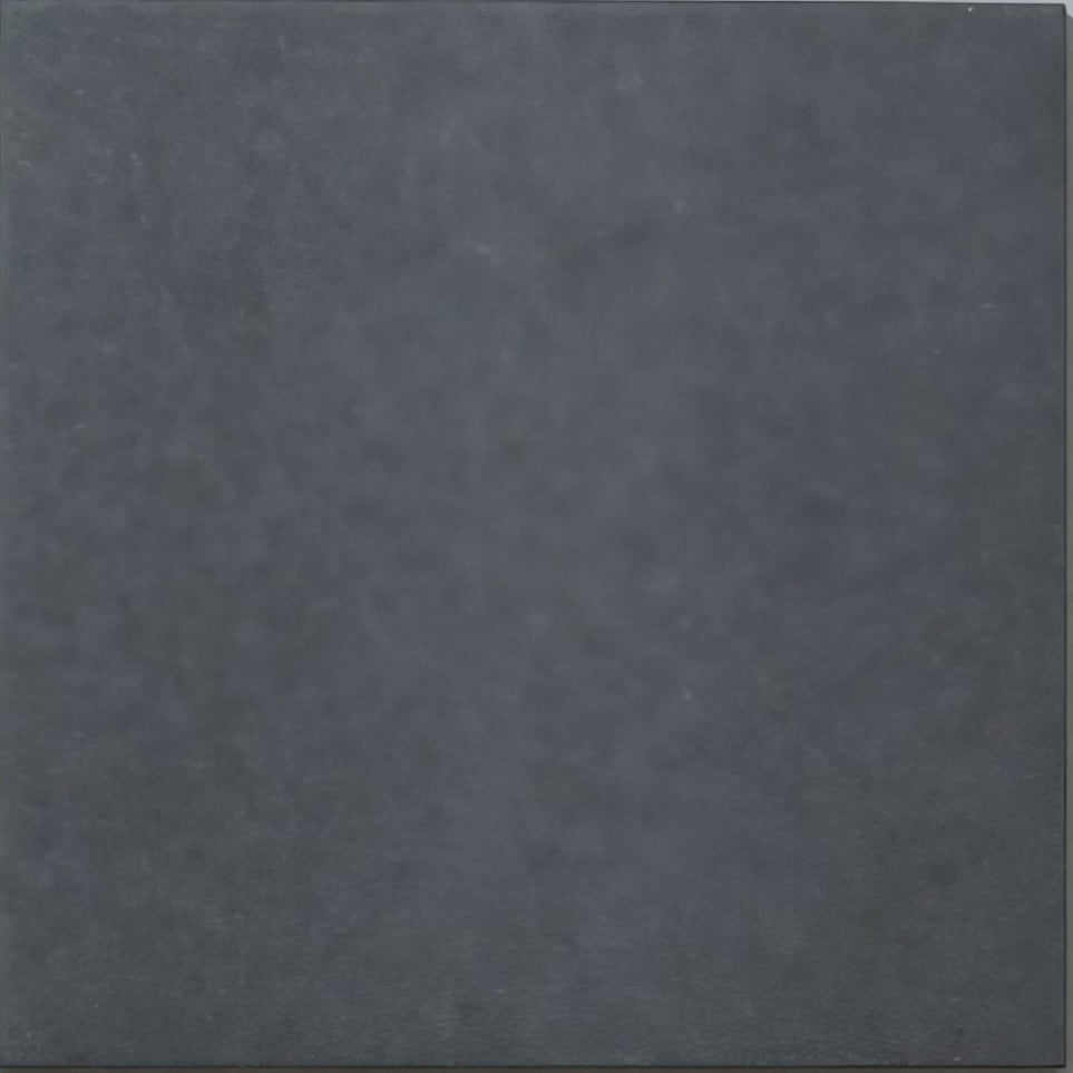 Dark gray textured porcelain tile with matte finish from bert and may old iron plain collection