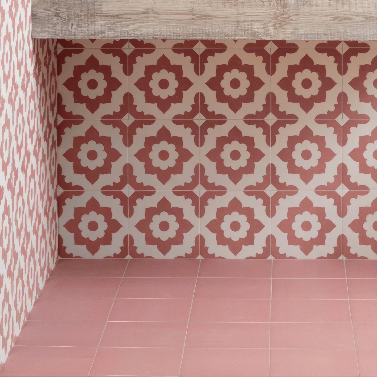 Red and cream floral patterned porcelain ceramic tiles from bert and may adorning the wall