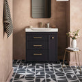Black vanity with gold hardware and white split shift old iron porcelain sink by Bert & May