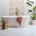 Bianco Oro Matt 90 x 90cm white marble-effect tiles with a white freestanding bathtub