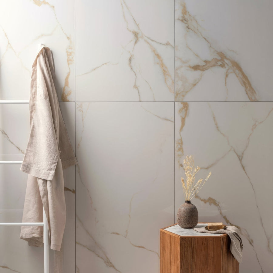 Bianco Oro Polished Porcelain 60 x 120cm white marble-effect porcelain with a beige linen robe on a rack