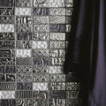 Black and white textured mosaic tile wall with intricate embossed patterns from the bihar mixed mosaic collection