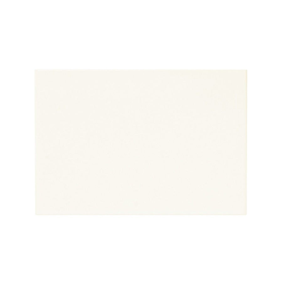 Cream-colored rectangular placemat made of matt white material for dining and table setting use