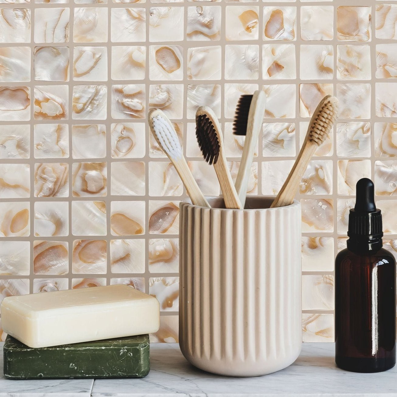 Cream-colored ribbed ceramic toothbrush holder in biscotti 25mm square design for bathroom organization
