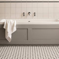 Black and White Honeycomb Floor Mosaic black and white hexagonal mosaic flooring with a grey bathtub and black taps