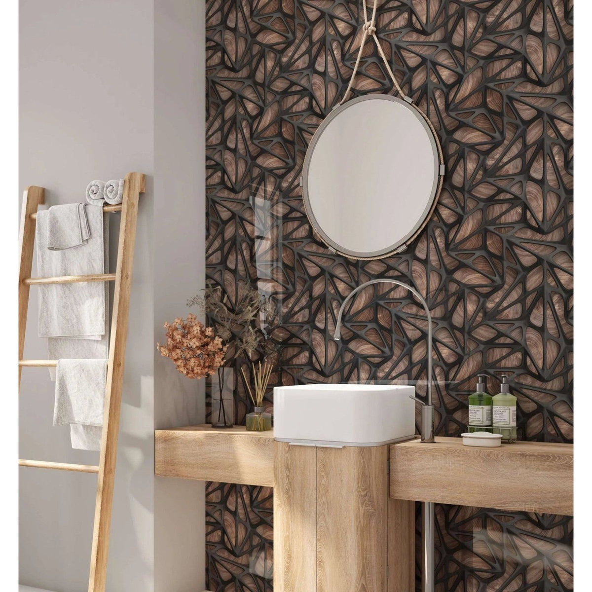 Round silver-framed mirror above white ceramic sink with black grid on wood shower panel in bathroom setting