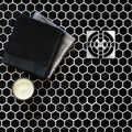 Black Honeycomb Floor Mosaic glossy black hexagonal mosaic flooring with a silver shower drain