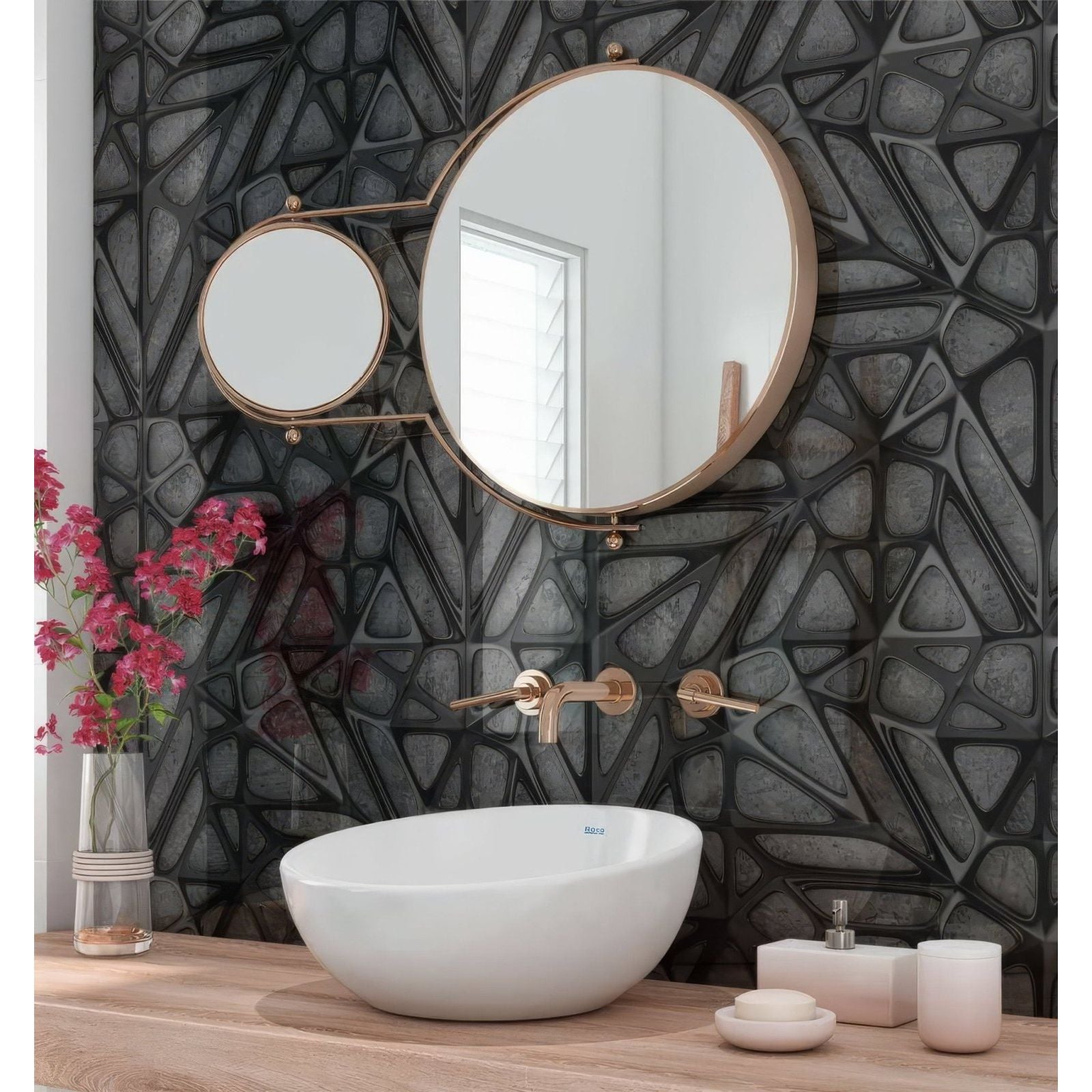 Round gold-framed bathroom mirror with smaller magnifying mirror on articulated arm over black lattice grid concrete shower panel