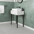 Black & White Honeycomb Floor Mosaic black and white hexagonal mosaic flooring beneath a marble-effect sink with black metal legs
