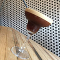 Black & White Honeycomb Floor Mosaic black and white hexagonal mosaic flooring with an espresso martini in a glass coupe