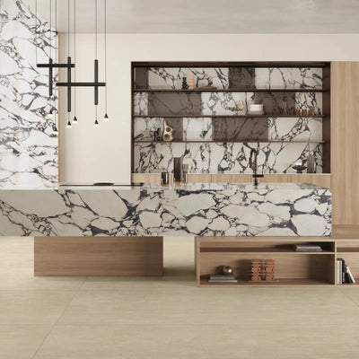 Black and white marble kitchen island with integrated sink, wooden base and shelving units.