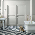 Blends Grigio Triangle beige marble triangle tiles with light grey panelled doors