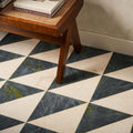 Blends tarla triangle geometric floor tiles with dark green and cream marble diamond pattern