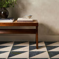 Blends Verde Triangle dark green marble triangle tiles with a wooden cane-top bench