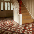 Blenheim black brown red and white geometric patterned tile floor with bold red white and black shapes