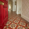 The patterned tile floor features blenheim brown, buff, green, red, and white in a geometric diamond design