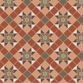 Teracotta and cream diamond patterned floor tiles with ornate green and gold floral medallions in blenheim colors