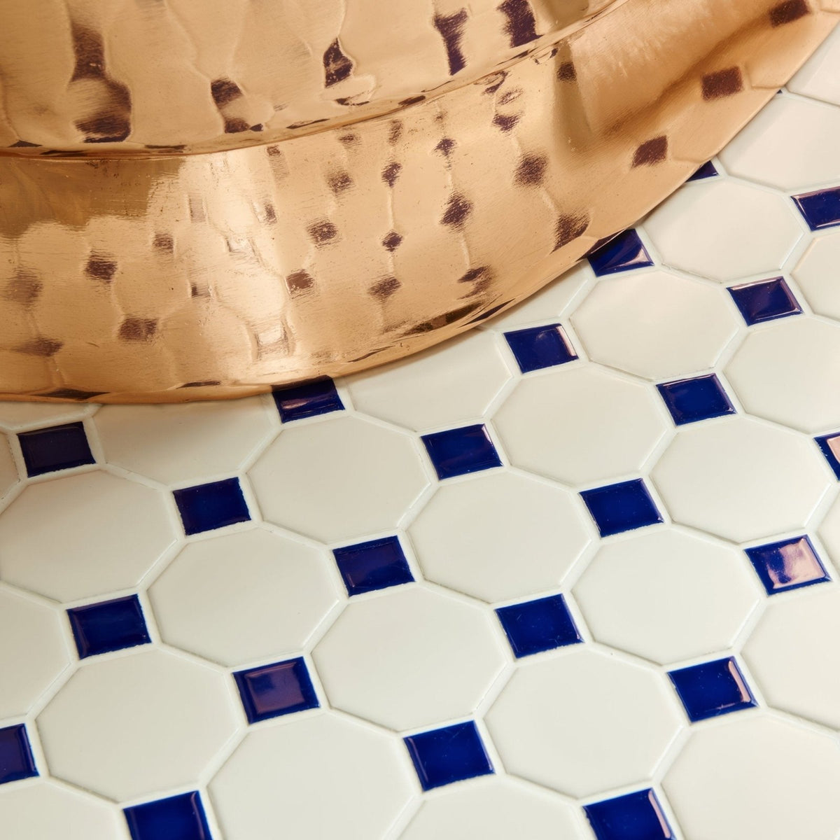 Blue Octagon & Dot Floor Mosaic white octagonal mosaic floor with navy dots, styled with a hammered copper bowl