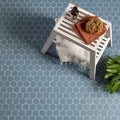 Blue/Grey Hexagon Slip Resistant blue and grey hexagon mosaic with a wooden stool and towel