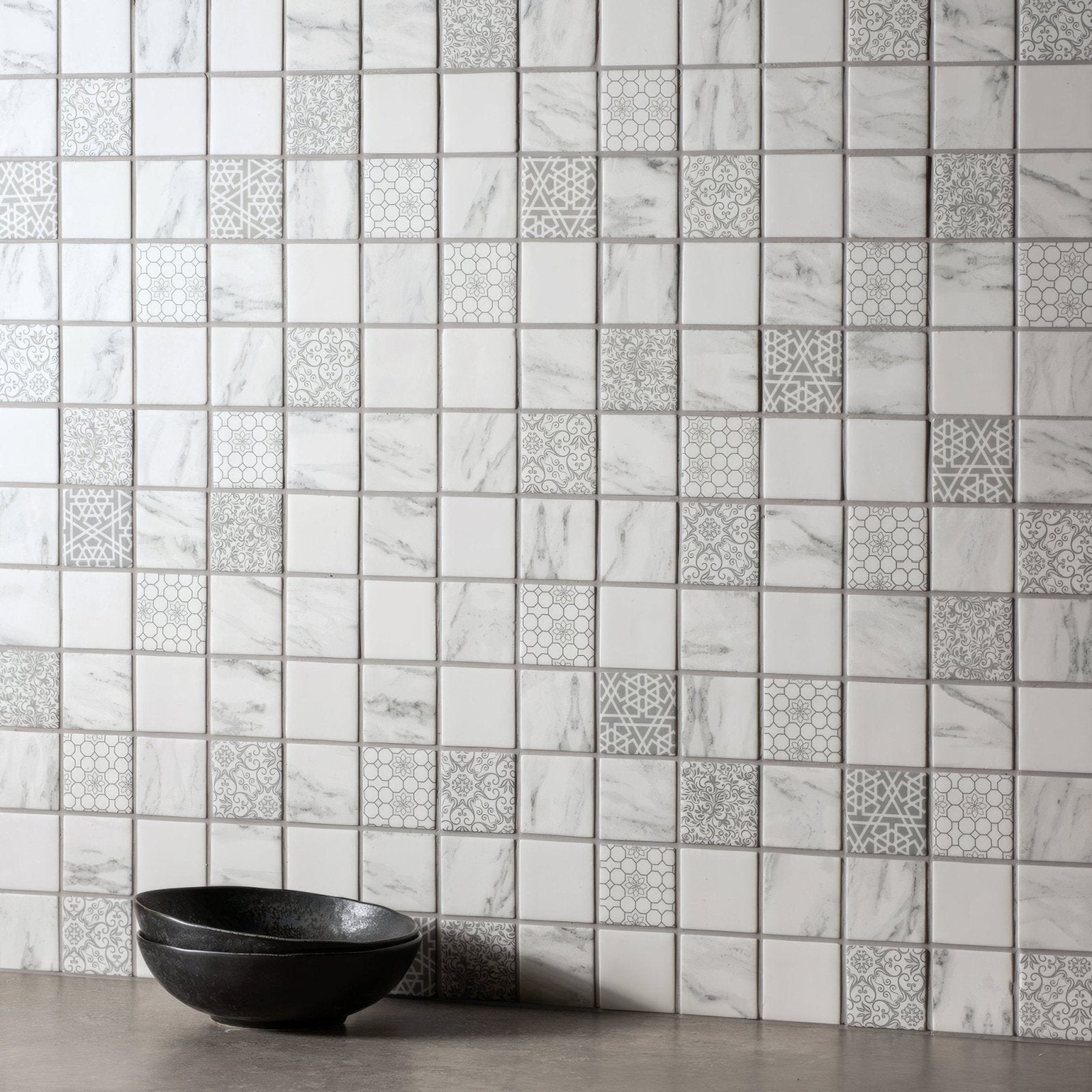 Bohemia recycled glass mosaic tile wall with white and gray marble pattern and decorative geometric accents