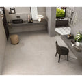 Modern minimalist bathroom featuring boost stone white 120 x 120cm concrete tiles with geometric accents and matte black fixtures