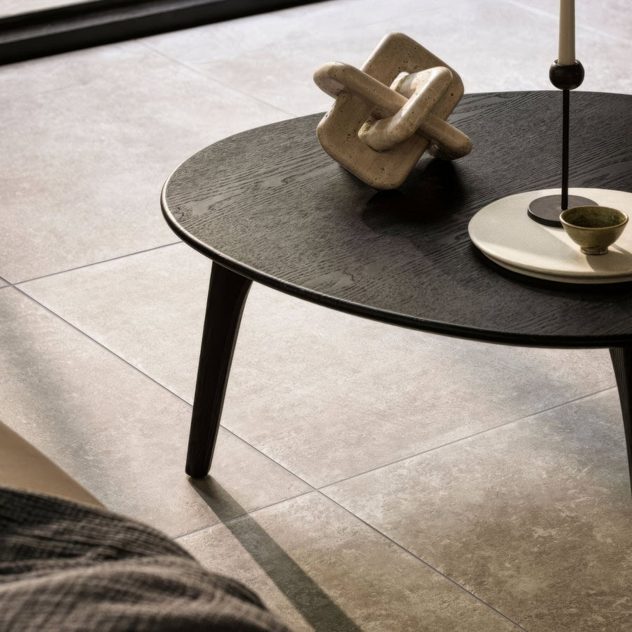 Dark wood oval coffee table with sleek tapered legs in bourgogne beige finish for stylish living spaces