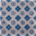Blue and white patterned ceramic tile with geometric starburst designs from bourron on truffle collection
