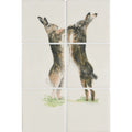 Cream-colored ceramic tile panel featuring two detailed brown and gray hares in upright boxing pose on off-white background