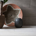 Black speckled ceramic vase made of brasilia cinza matt glazed porcelain with a smooth matte finish